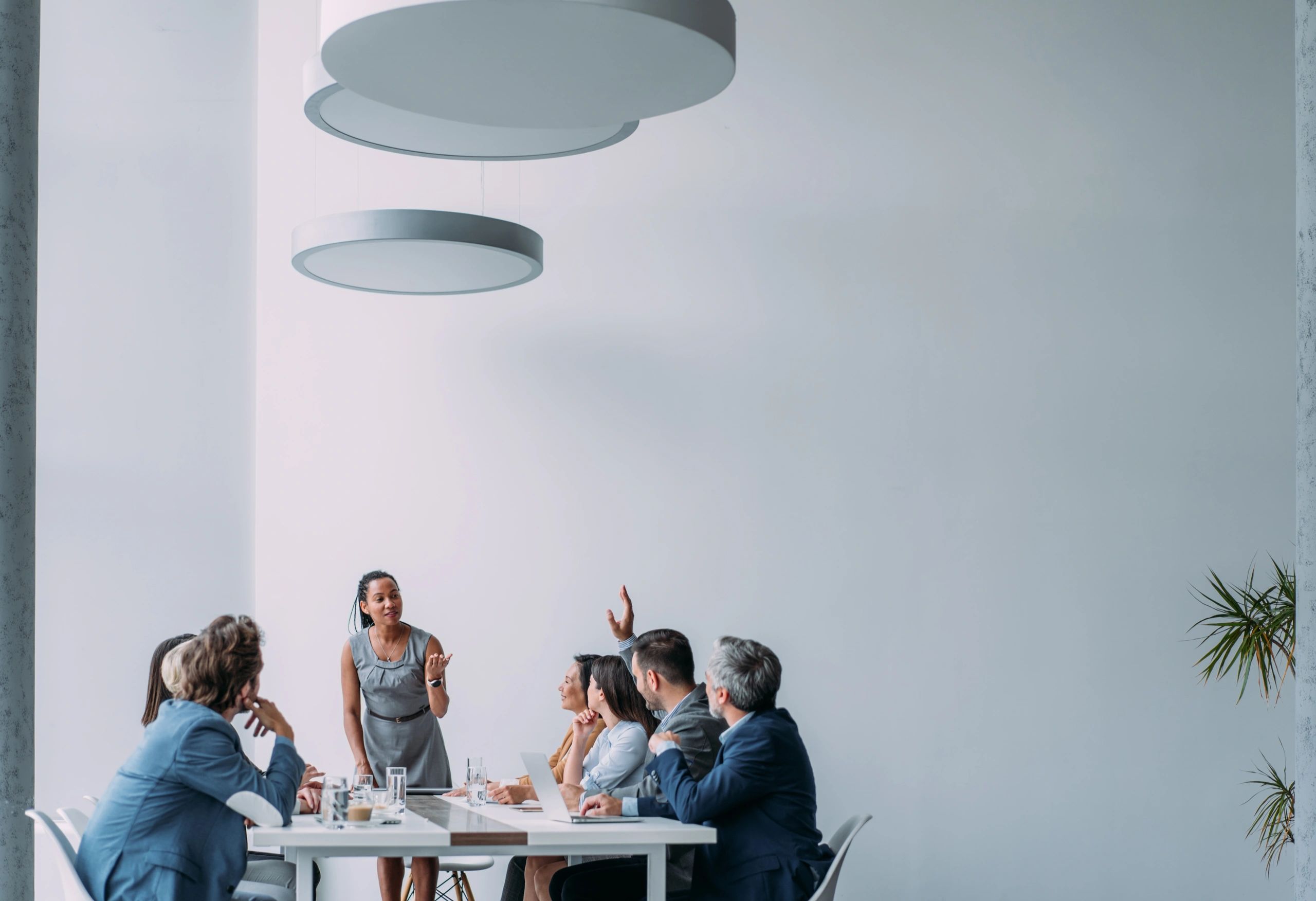 Businesswoman presenting to a team in a meeting room